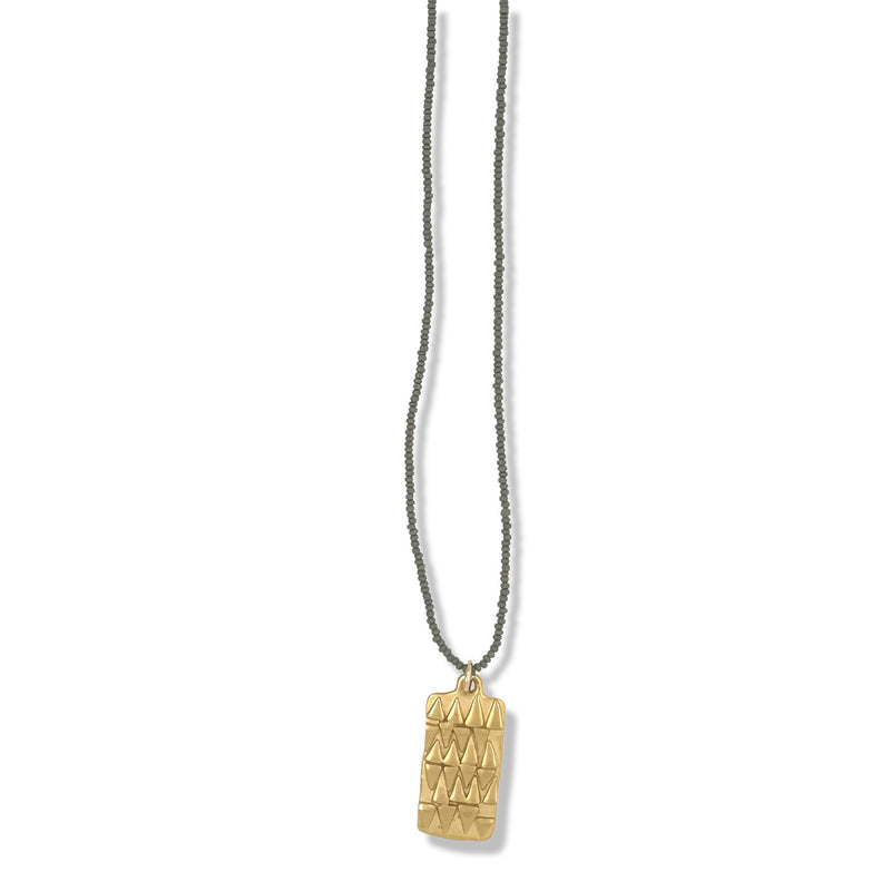 GOLD TRIBAL TAG NECKLACE ON CHARCOAL BEADS