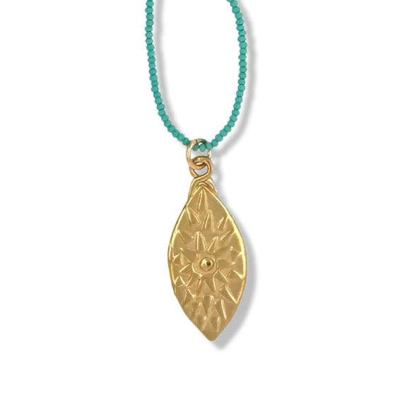 URSA NECKLACE IN GOLD ON TURQUOISE BEADS