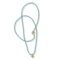 Single gold dot Necklace on turquoise beads by Keely Smith Jewelry Designs