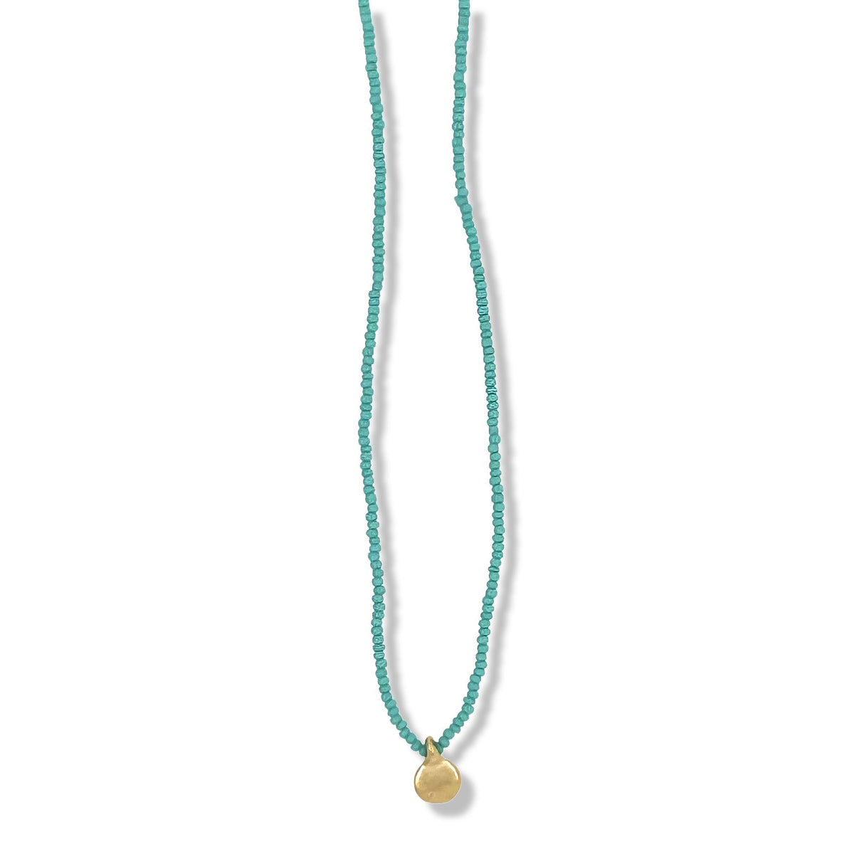 Single gold dot necklace on turquoise beads By Keely Smith Jewelry Dessigns