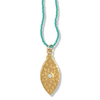 URSA NECKLACE IN GOLD ON TURQUOISE BEADS