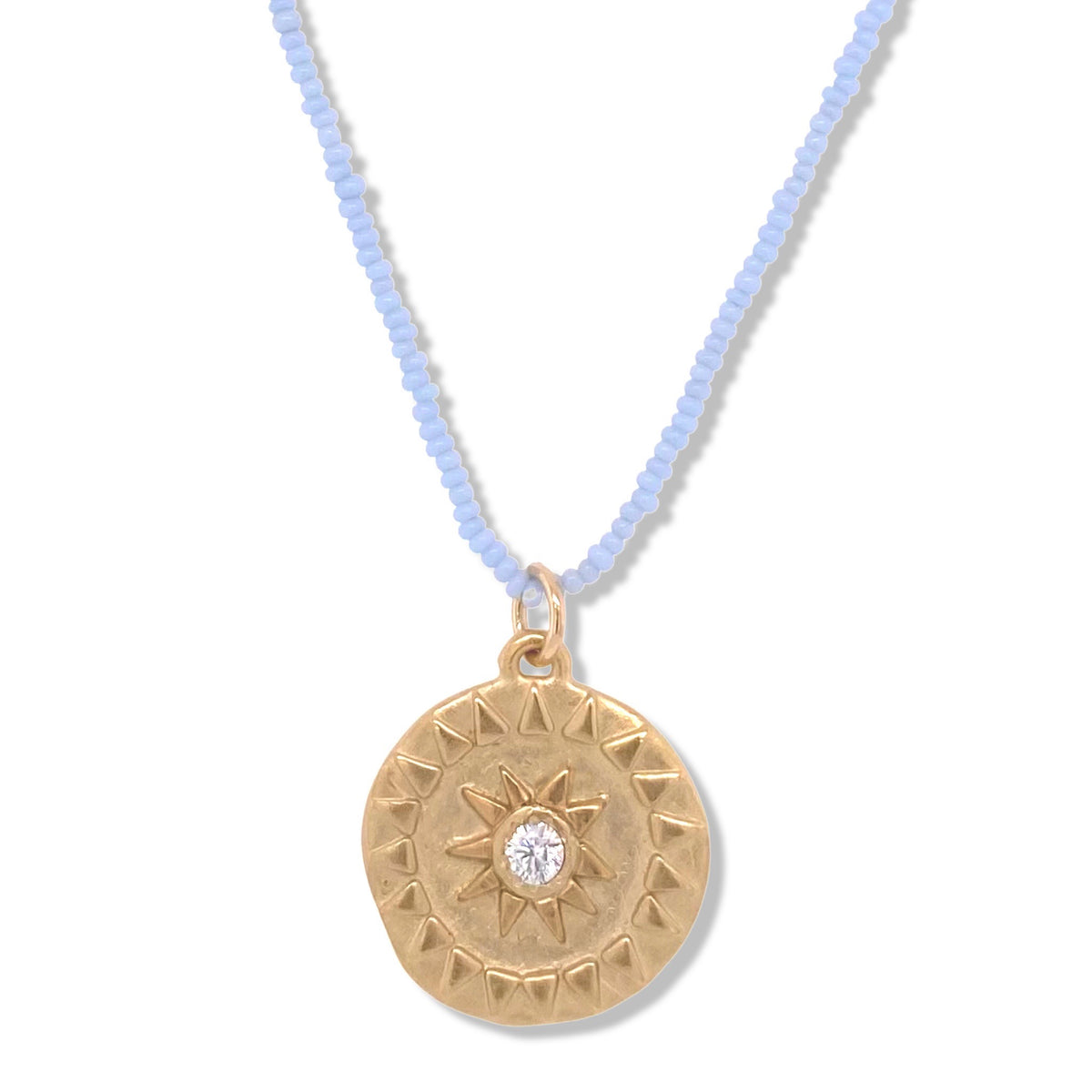 SOL NECKLACE IN GOLD ON BABY BLUE BEADS