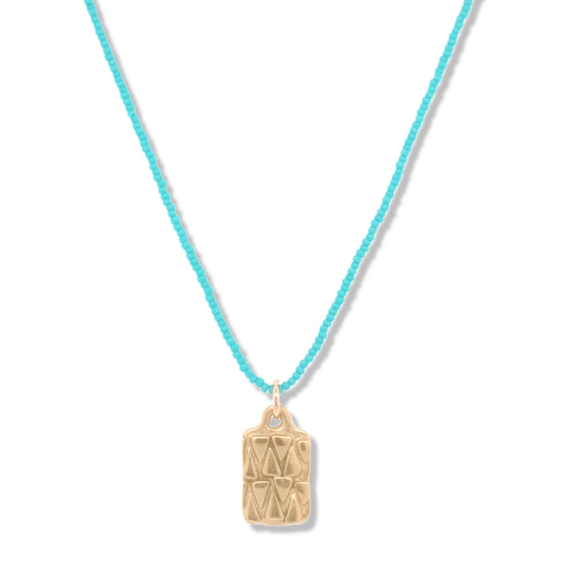 TRIBAL MINI DOG TAG IN GOLD ON TURQUOISE BEADS